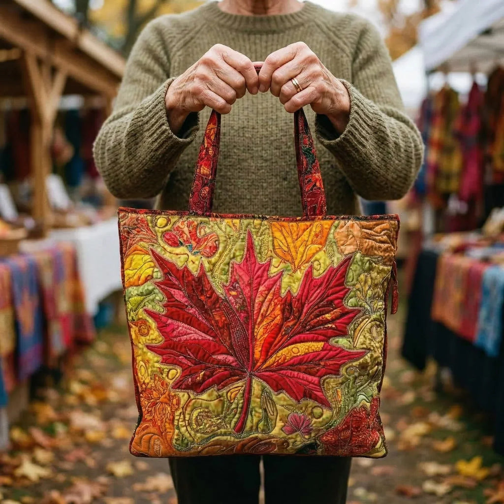 Woman carrying the Maple at Sunset artisan quilted tote bag
