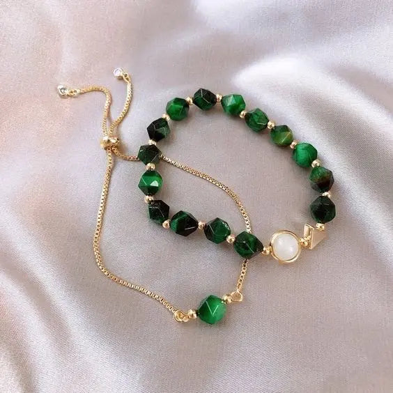 Green beaded bracelet and gold-tone chain bracelet