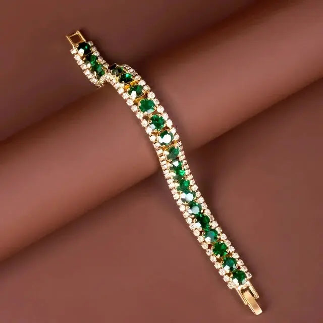 Gold-tone bracelet with emerald-green stones