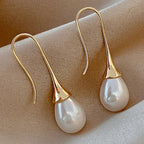 Teardrop pearl earrings on gold-tone tulip hooks