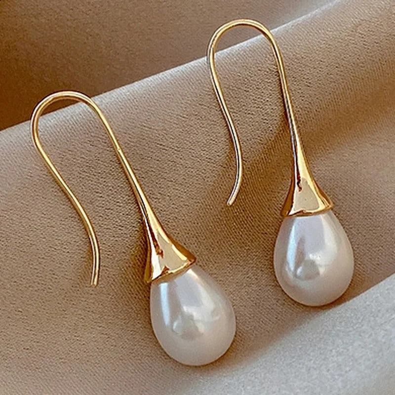 Teardrop pearl earrings on gold-tone tulip hooks
