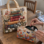 Close-up of the Meadow Floral tote and the open Bloom Garden makeup bag with lipstick and keys