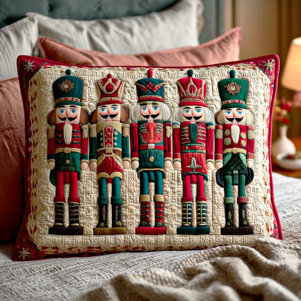 Quilted pillowcase with the Nutcracker Parade design of red and gold nutcracker soldiers in rows with drums and stars between them