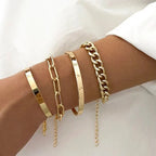 Stack of gold-tone chain bracelets and bangles