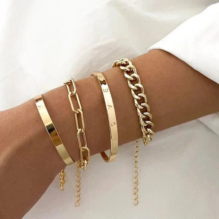 Stack of gold-tone chain bracelets and bangles