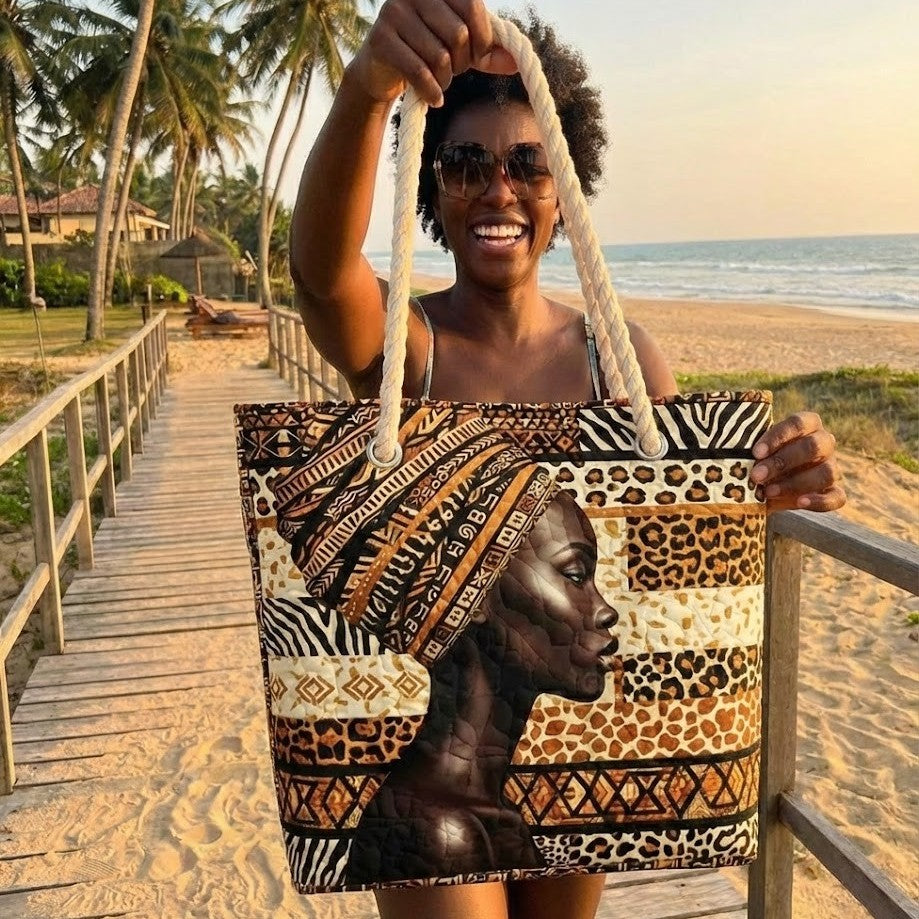 Woman carrying the Radiant Queen quilted beach bag along the shore