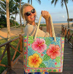 Quilted beach bag with the Tropical Flower design, a large pink and coral hibiscus on broad green leaves