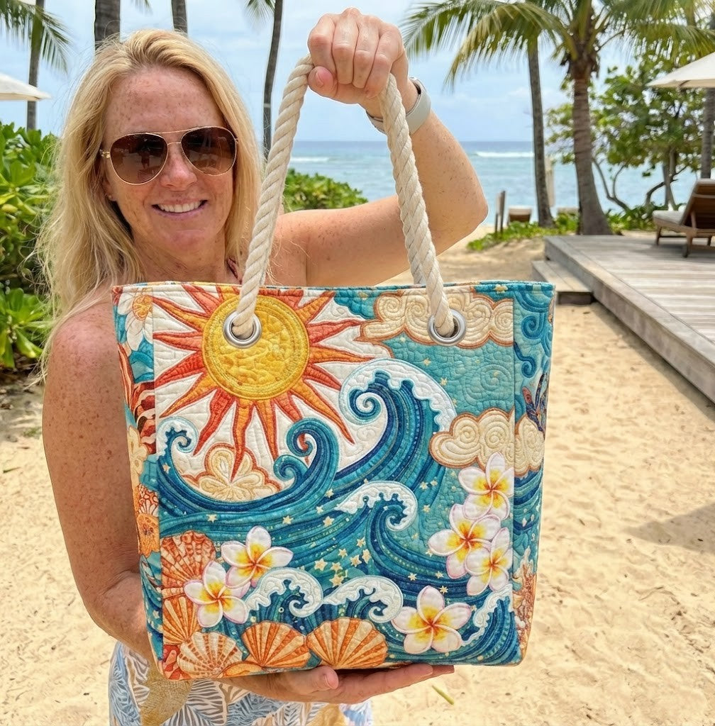 Woman carrying the Warm Halo quilted beach bag along the shore